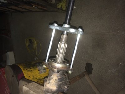 Pulling the axle tube and bearing off together.